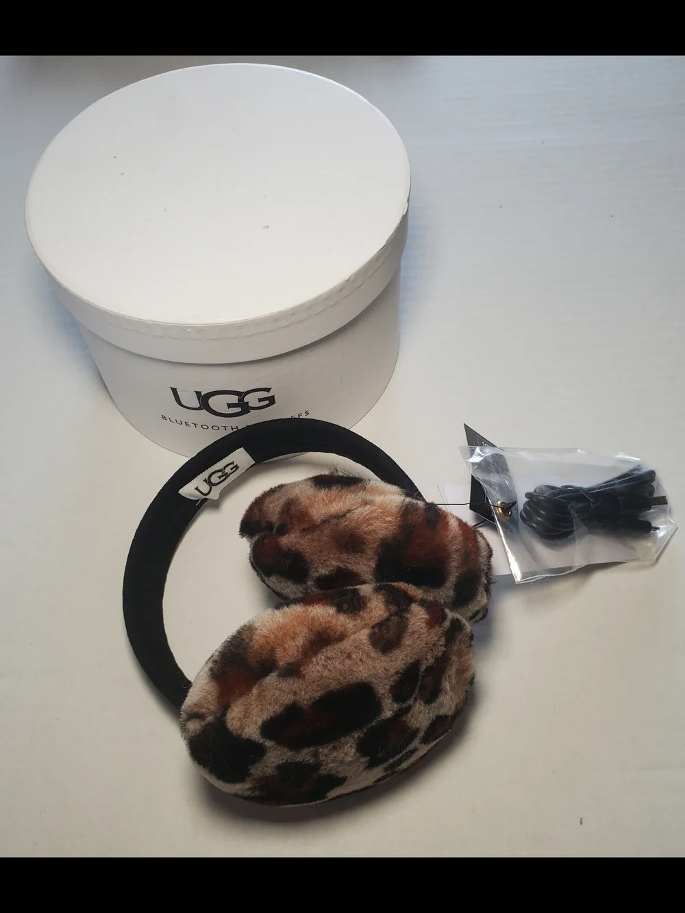 UGG Sheepskin Leopard Print Adjustable Wireless Bluetooth Earmuffs. NIB $75.00